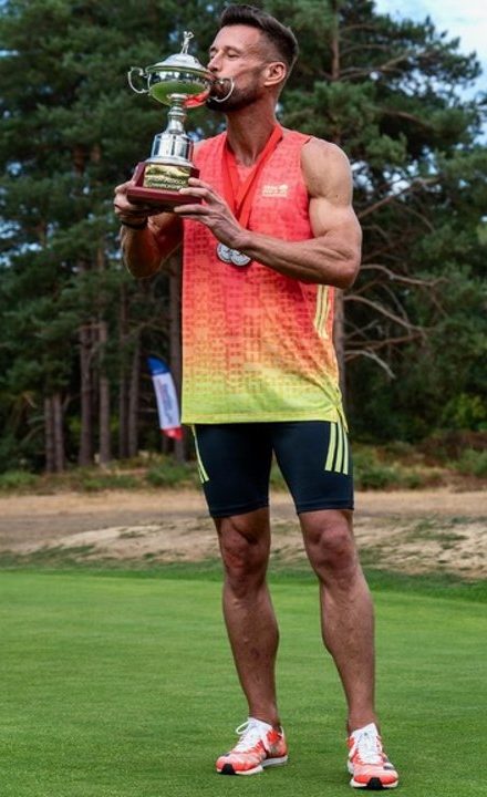 James Hardy kissing the British Championship trophy on the green